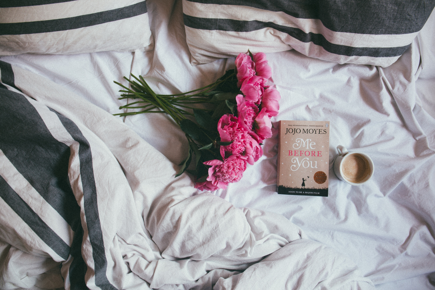Bouquet of Flowers with Book and Coffee in Bed